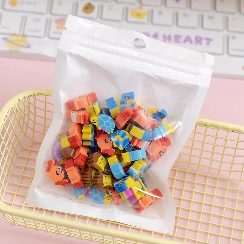 Open pearlescent film bag showing 50 small colourful cartoon fruit-themed rubber erasers.