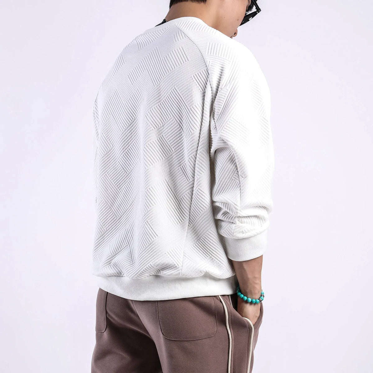 Men's army green twill Jacquard pullover sweater with round neck and long sleeves laid flat