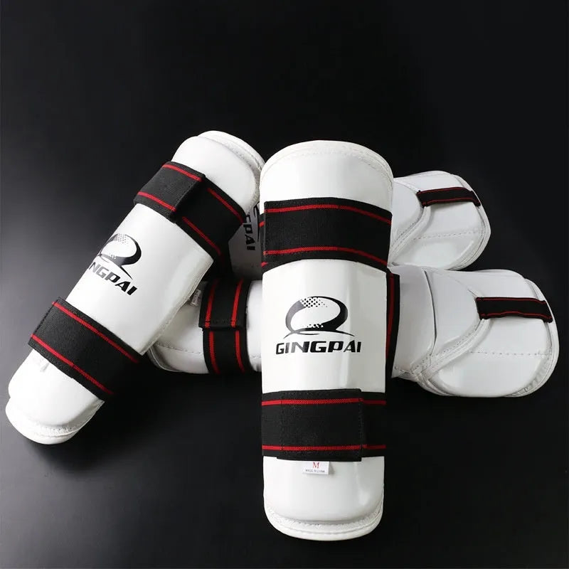 Taekwondo protective gear set showing arm guards, elbow protection and legguards in adjustable sizes