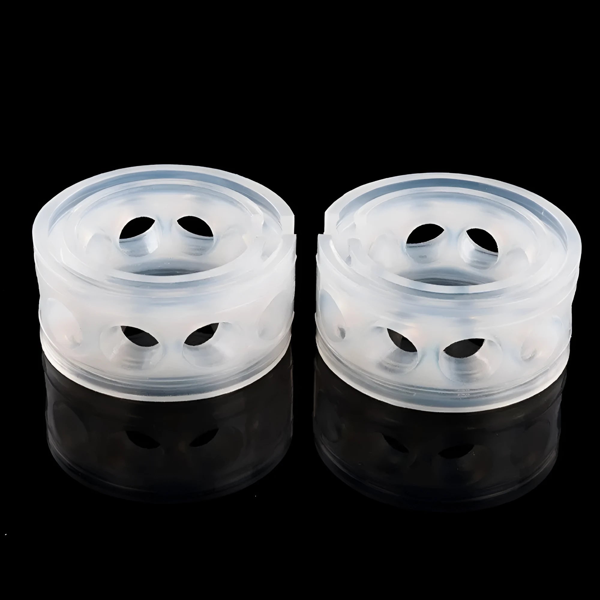 Transparent rubber shock absorber buffers for car springs in six sizes with visible spring gap.