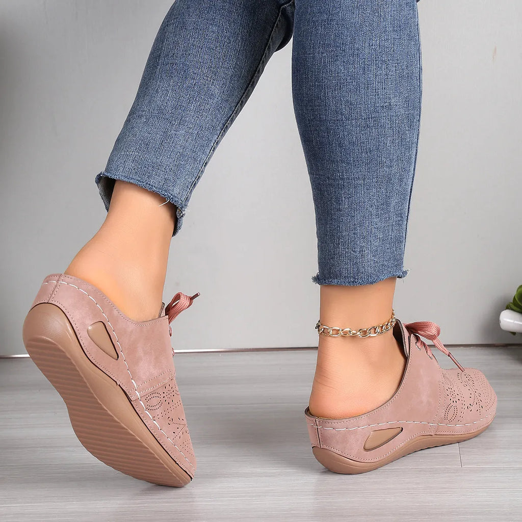 Women's summer baotou lace-up slippers with hollow-out wedge sole in a light grey colour.