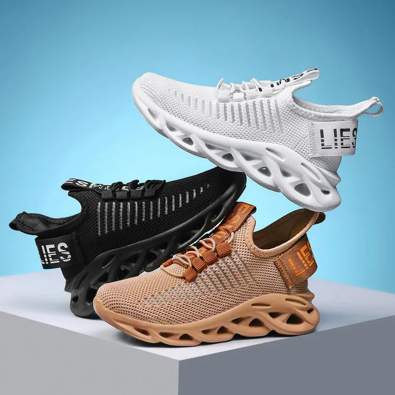 Children's fabric sneakers with Velcro strap in black, khaki, and white colours on a neutral background.