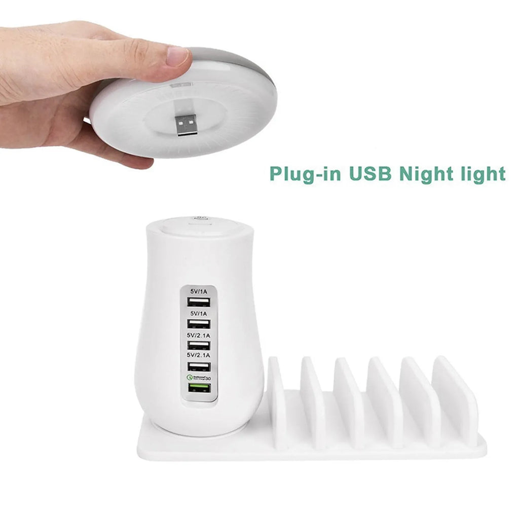 White mushroom-shaped LED lamp and 5-port USB charging dock station on a wooden desk.