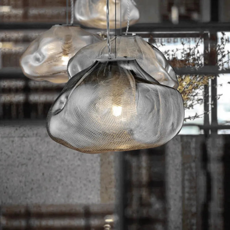 Modern glass decorative chandelier light fixture in amber, clear or smoke grey colour.
