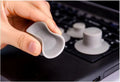 Four grey durable plastic laptop cooling pads in two sizes on a flat surface