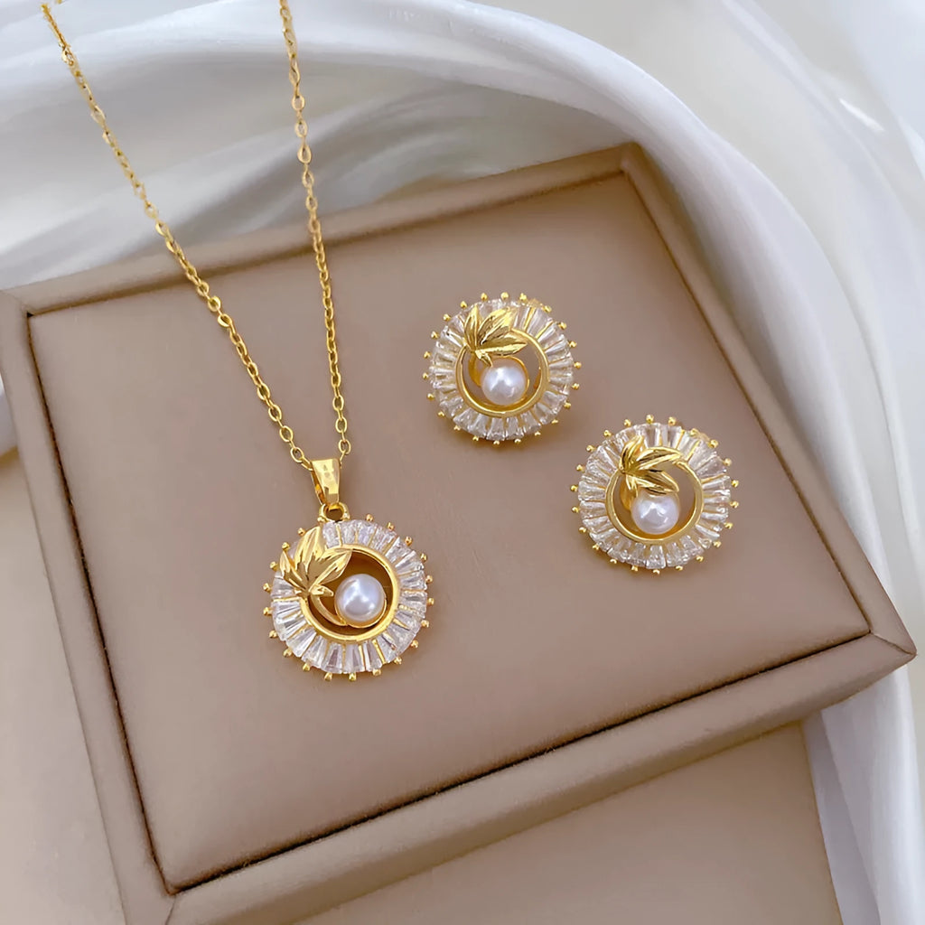 Titanium steel jewellery set with square ring, round ring, leaves necklace and stud earrings