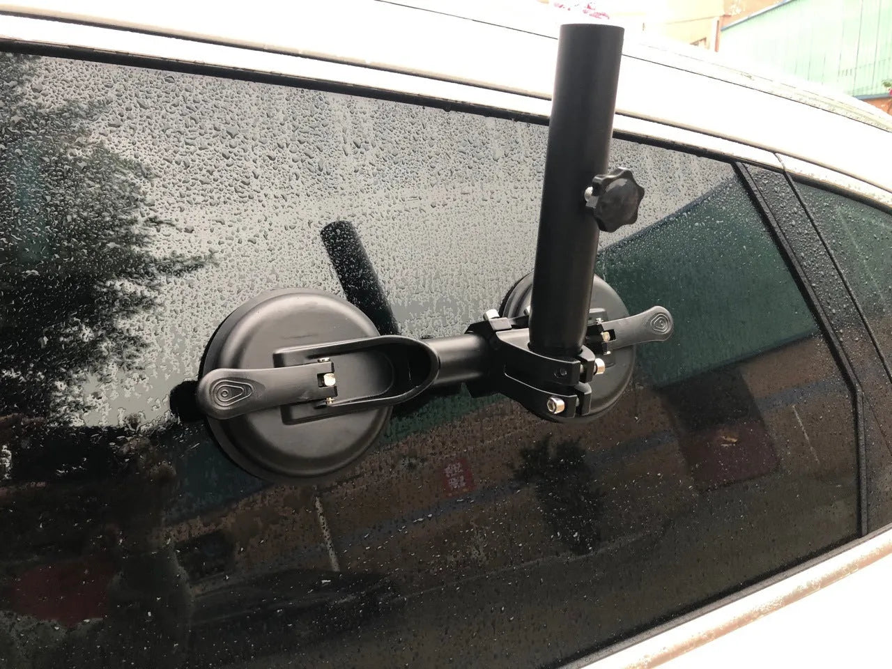Black off-road car flagpole sucker base with round glass suction cup, showing ABS and rubber construction.