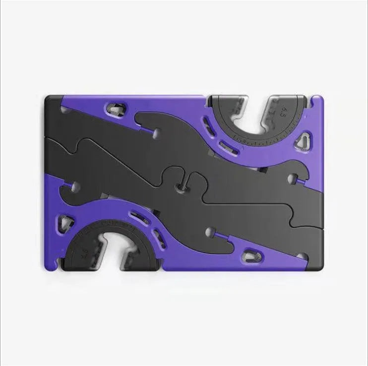 Black plastic card type mobile phone holder with lazy bracket on a desktop.