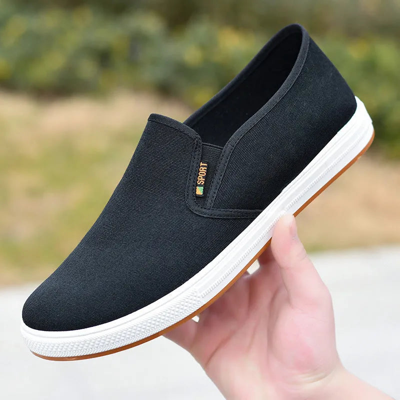Men's black slip-on canvas cloth shoes with round toe and injection moulded sole