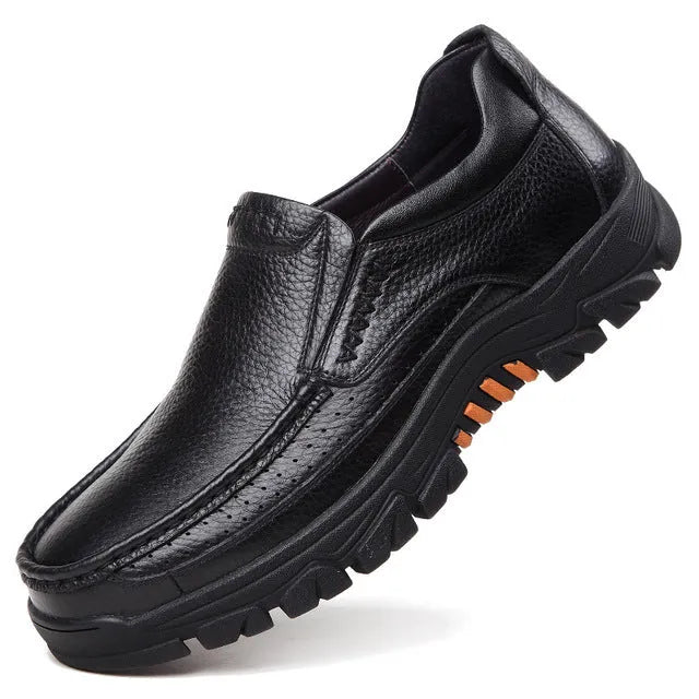 Business casual leather slip-on shoes in black and brown colours showing rubber sole and professional design