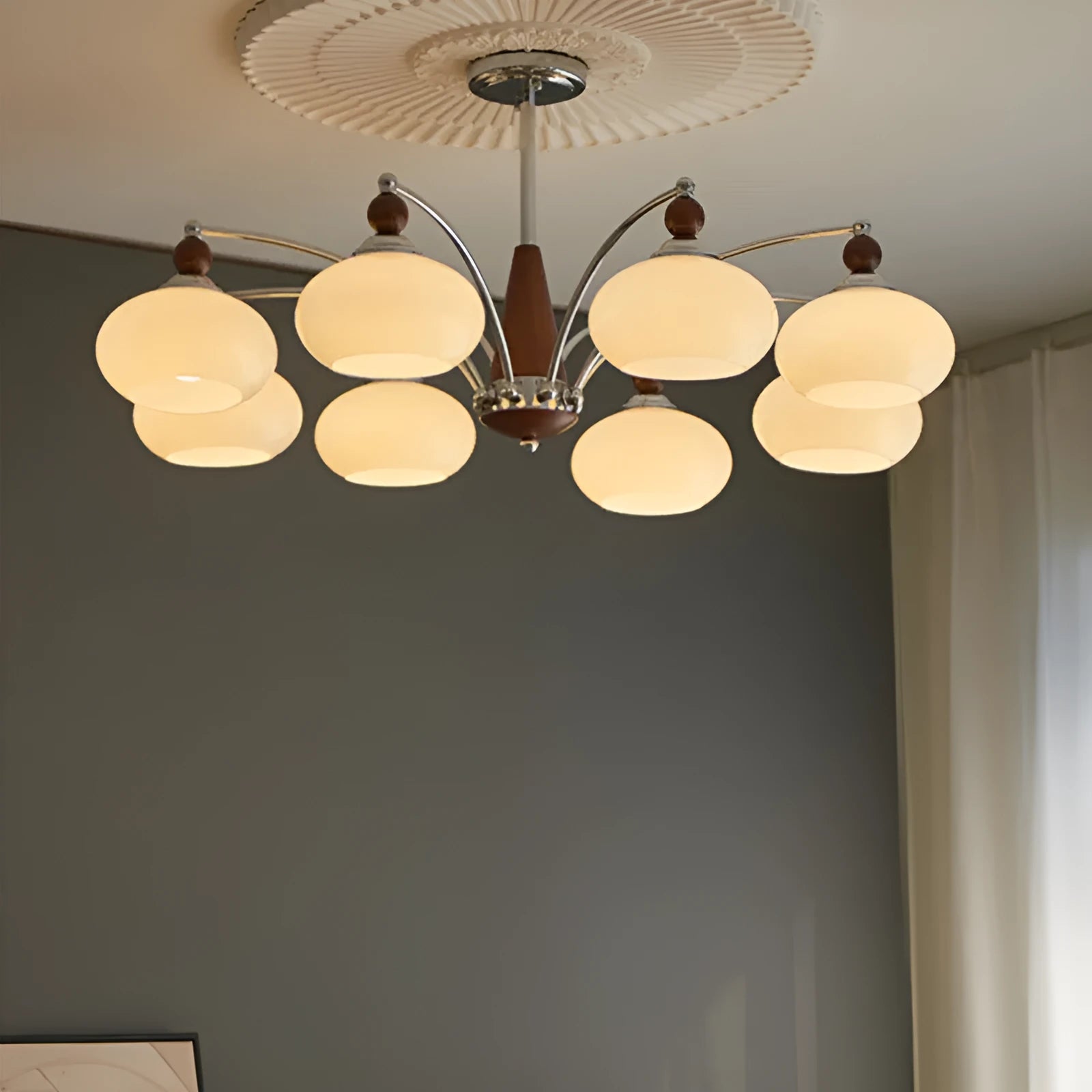 Persimmon glass and chrome chandelier with multiple light heads in Middle Ancient style