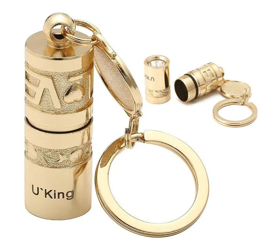 Gold zinc alloy waterproof mini LED flashlight attached to a keyring.