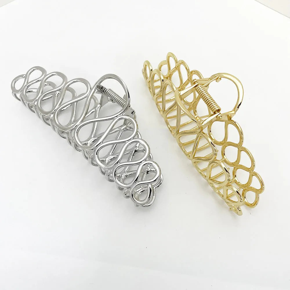 Large gold alloy hair clip with tassel decoration for updo hairstyles
