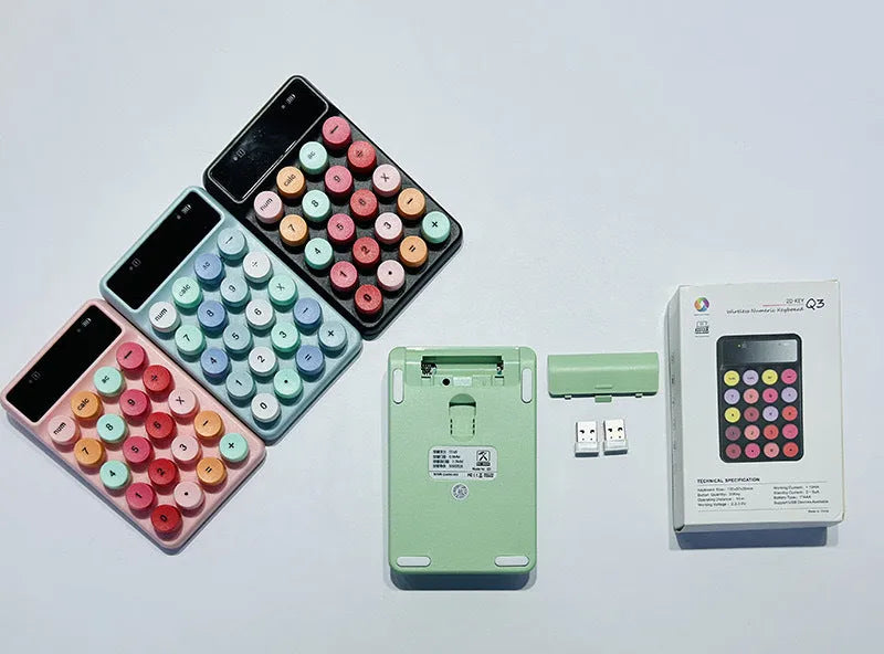 Mini portable wireless keyboard in macaron mixed colours on a desk.