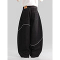 Black straight-leg jeans with micro-elastic polyester denim fabric showing zip fly and mid-rise waist