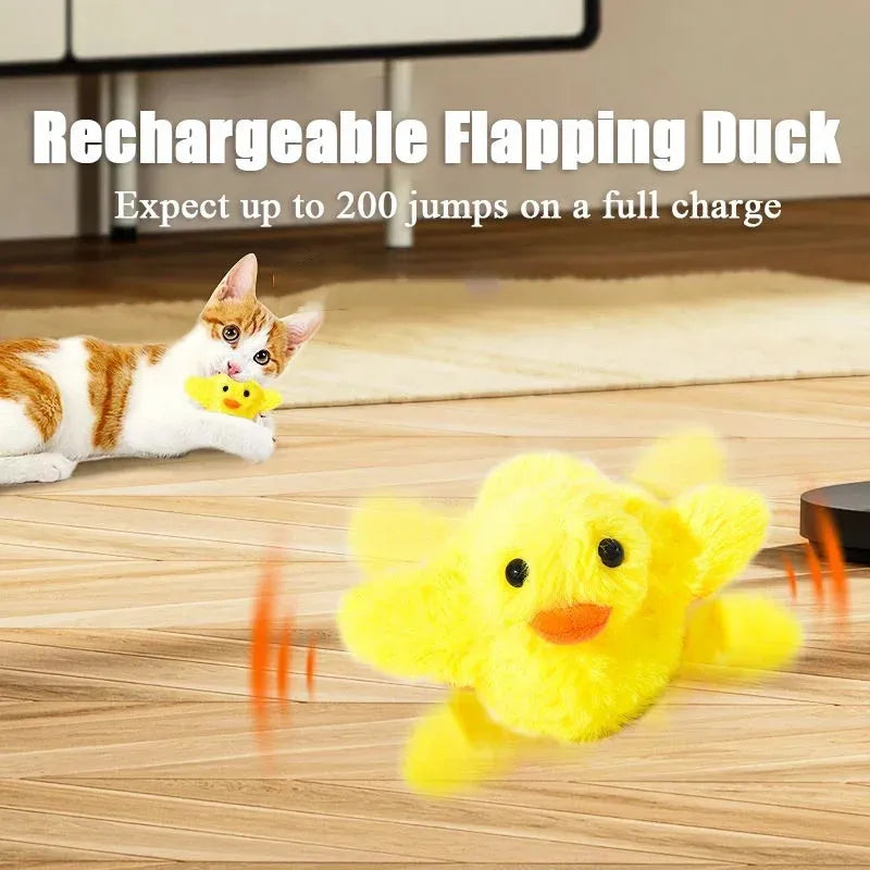 Yellow chick-shaped flapping duck cat toy with plush fabric on a floor.