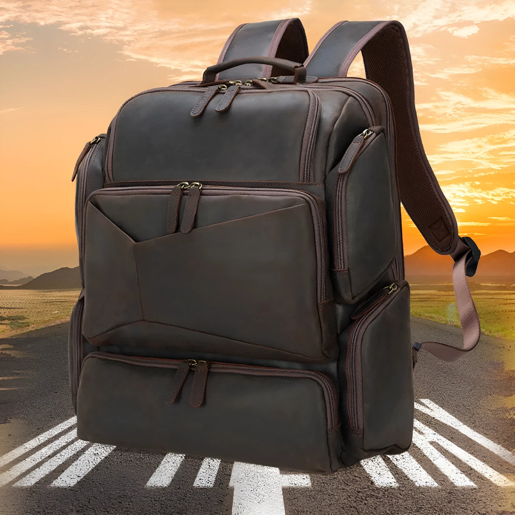 Dark brown genuine leather backpack with 17-inch laptop compartment and multiple organisational pockets