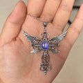 Close-up of a devil wings and cross geometric alloy pendant necklace on a chain.