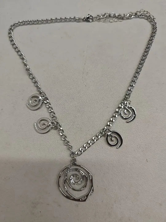 Spiral donut jewellery set with necklace, bracelet and ear hooks in gold or silver tone