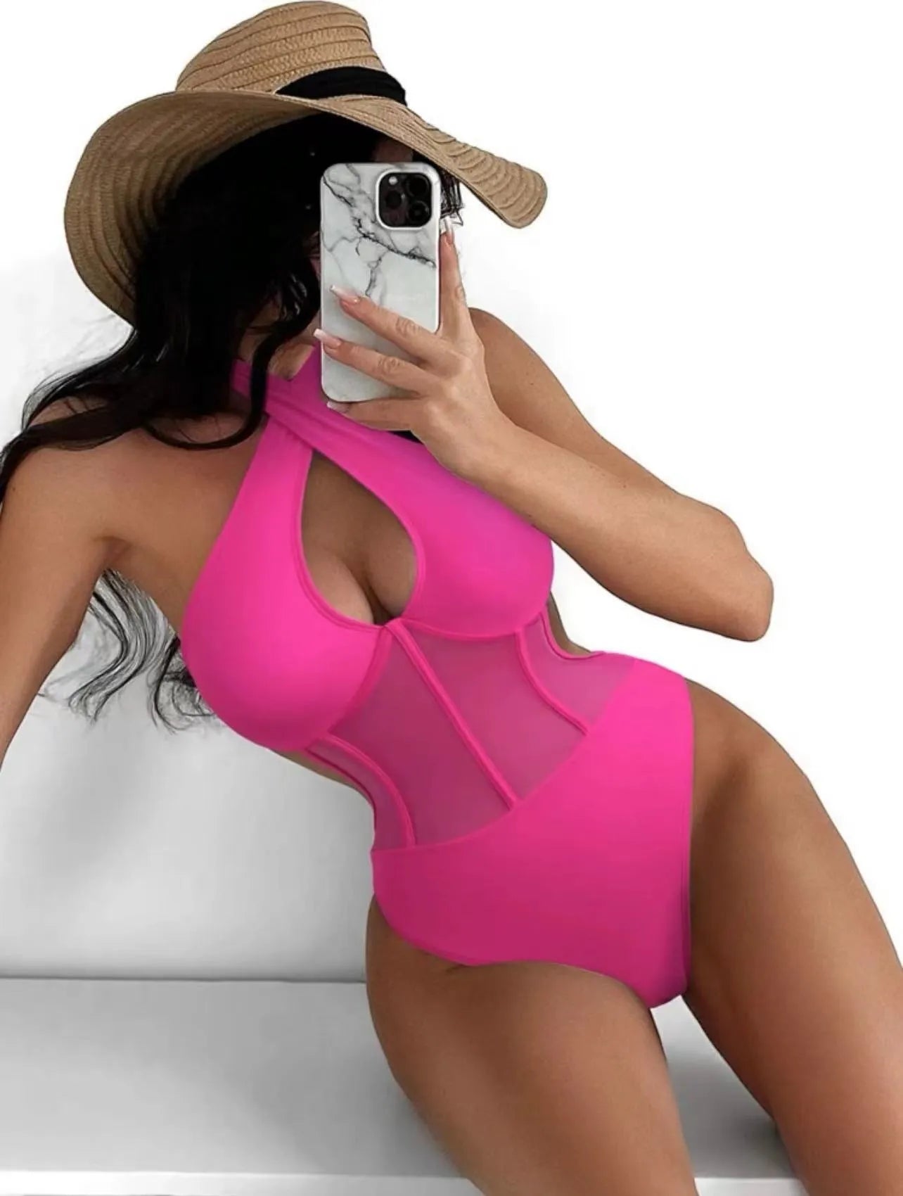 A black ladies one-piece swimsuit bikini made from nylon and spandex fabric on a mannequin.