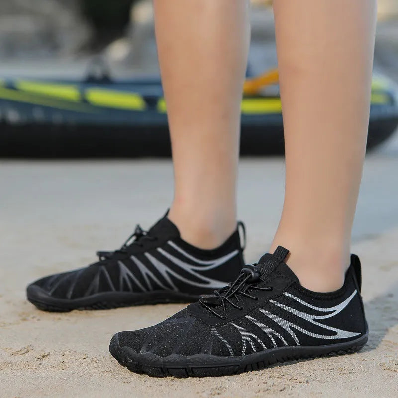 Breathable men's and women's low-top running shoes in a colour option with a lace-up front and rubber sole.