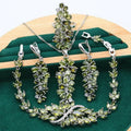 Complete retro jewellery set with floral pattern showing necklace, bracelet, earrings, and ring in olive, purple, or colourful finishes