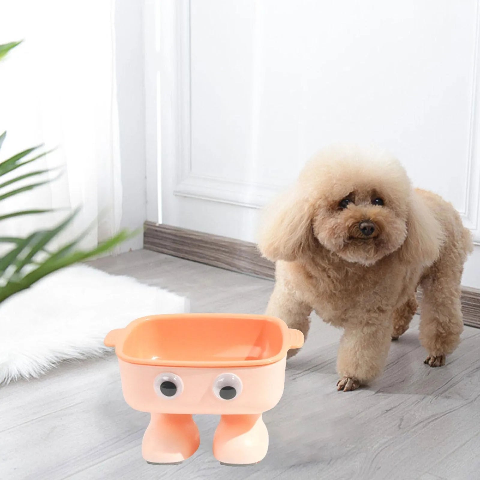 Robot-shaped elevated cat bowl with tilted feeding surface in green colour