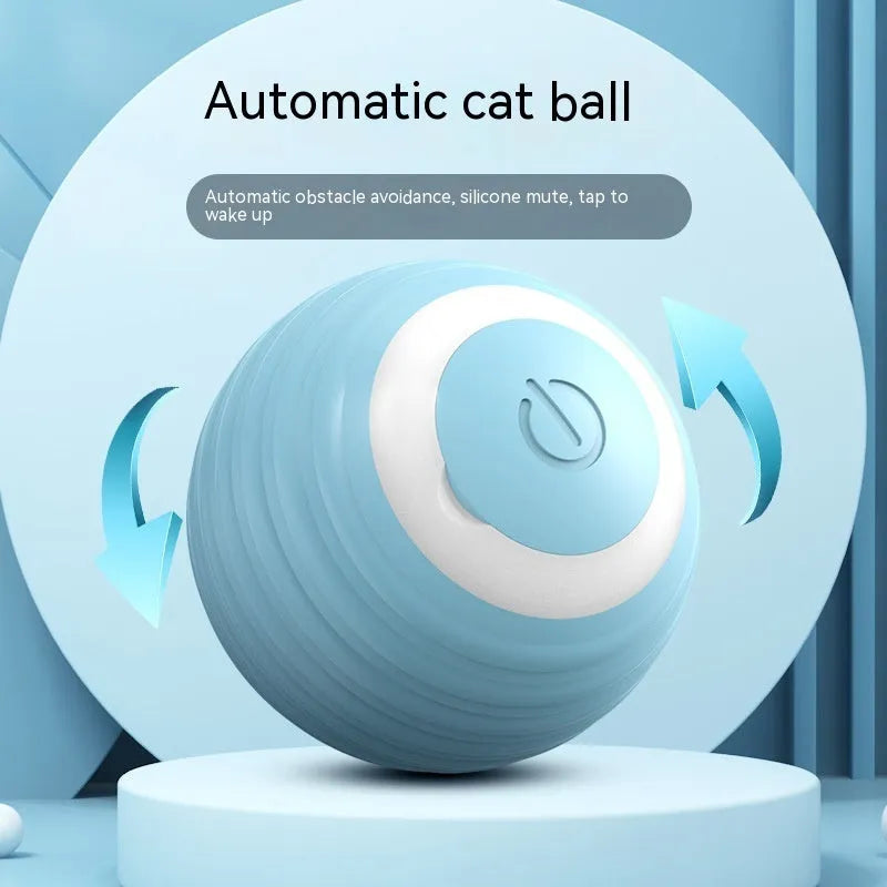 Blue automatic moving silicone ball cat toy with charging cable on hard floor