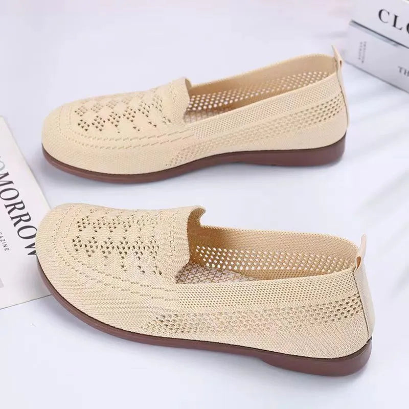 Women's beige low-top mesh tennis shoes with a round toe and anti-skid PVC sole, shown on a neutral background.