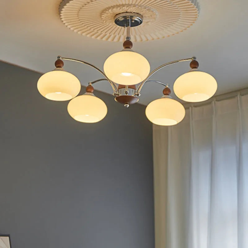 Persimmon glass and chrome chandelier with multiple light heads in Middle Ancient style