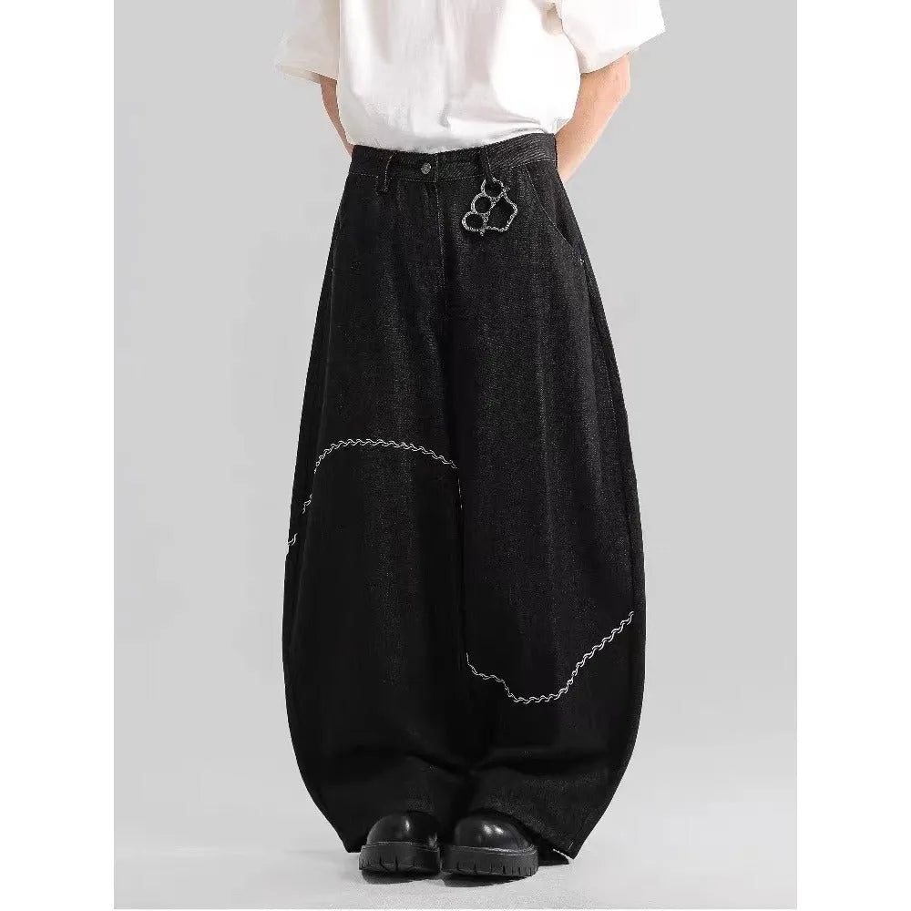 Black straight-leg jeans with micro-elastic polyester denim fabric showing zip fly and mid-rise waist