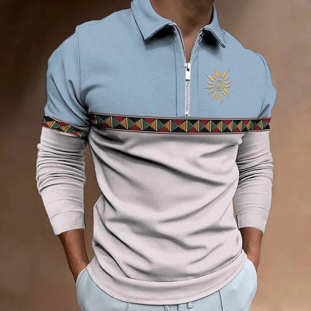 Man wearing a long-sleeved loose-fit striped top with retro colour printing and zipper details.
