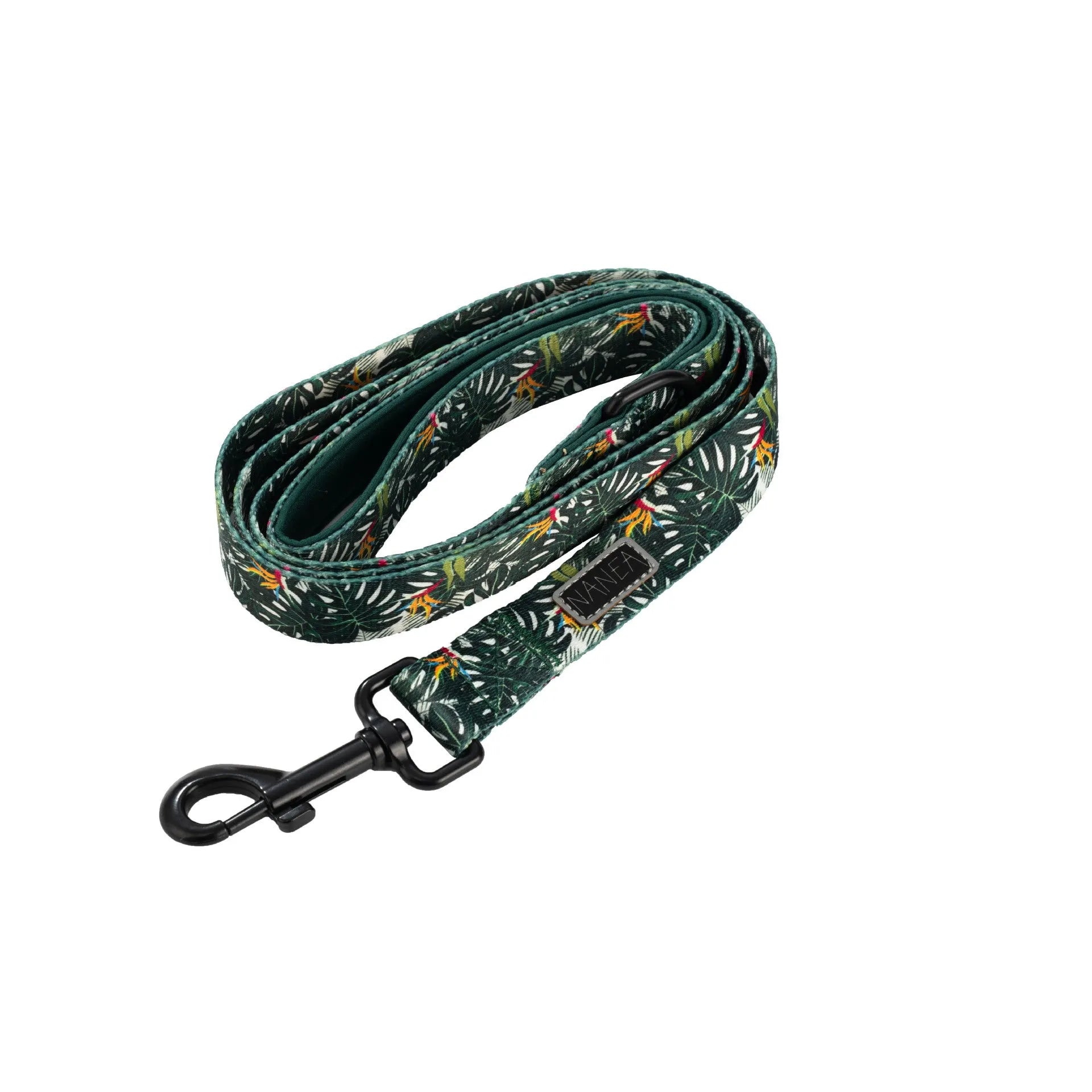 Six-piece adjustable cloth dog harness set on a table, showing vest, collar, rope, waste bag, bow, and triangular scarf.