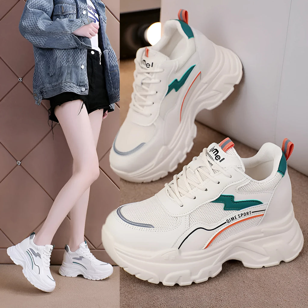 Women's white and beige dad shoes with cross shoulder straps and lace-up front, showing round toe.