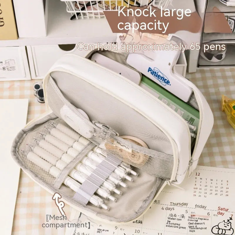 Korean style canvas pencil case in green, beige, blue, or grey, showing large capacity for pens.