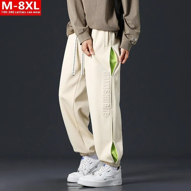 Men's loose cotton trousers with stitching printing design and ankle banded cuffs in black colour