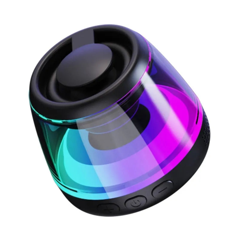 White portable Bluetooth speaker with magnetic base and ambient light on a metal surface.