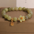 A grey jade coloured alloy bracelet with a casual style for women.