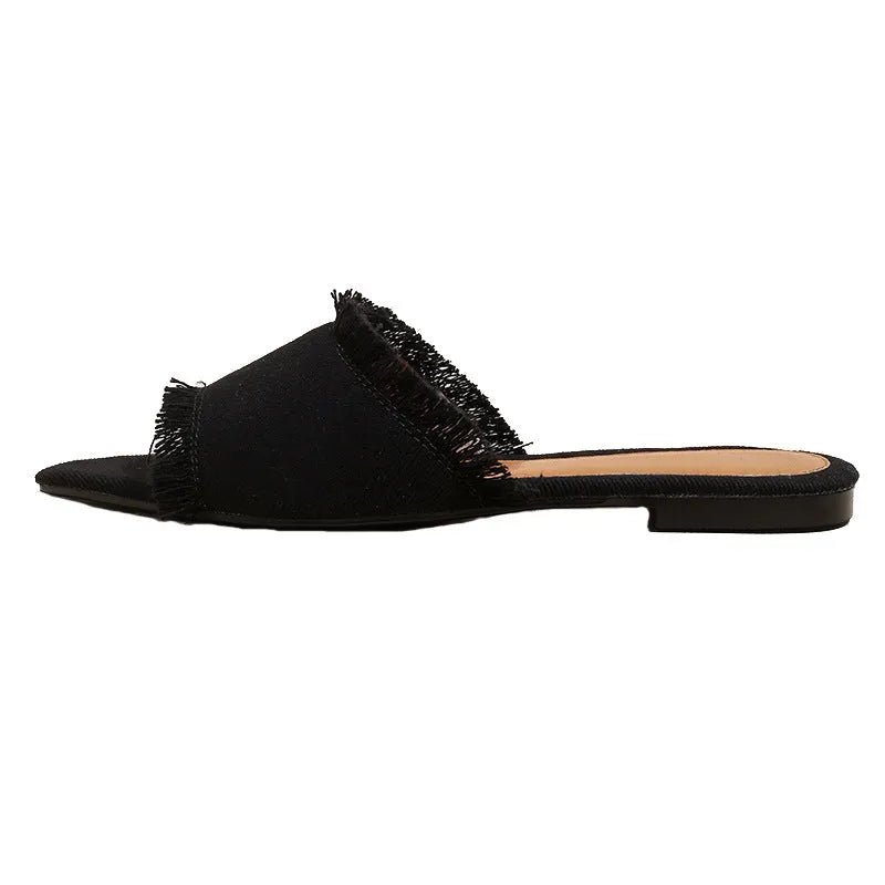 Women's denim flat slippers with leather lining and tassel detail in solid colour