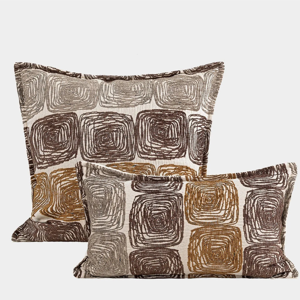 Square pillow cover with abstract coil pattern in cream and coffee colours