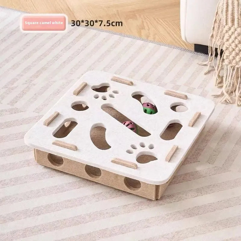 Green brown felt square cat toy with a hole in the centre on a wooden floor.