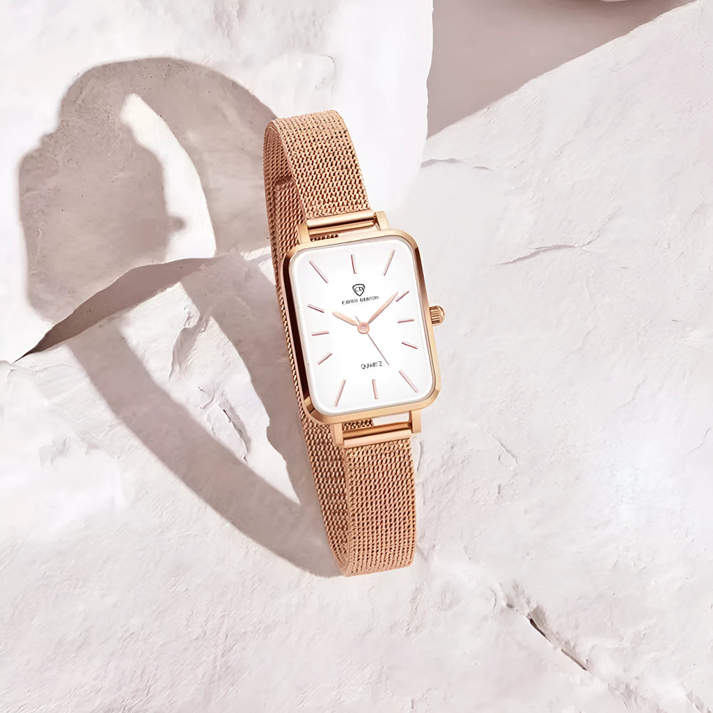 Women's rose gold or silver waterproof quartz watch with woven steel band and alloy case.