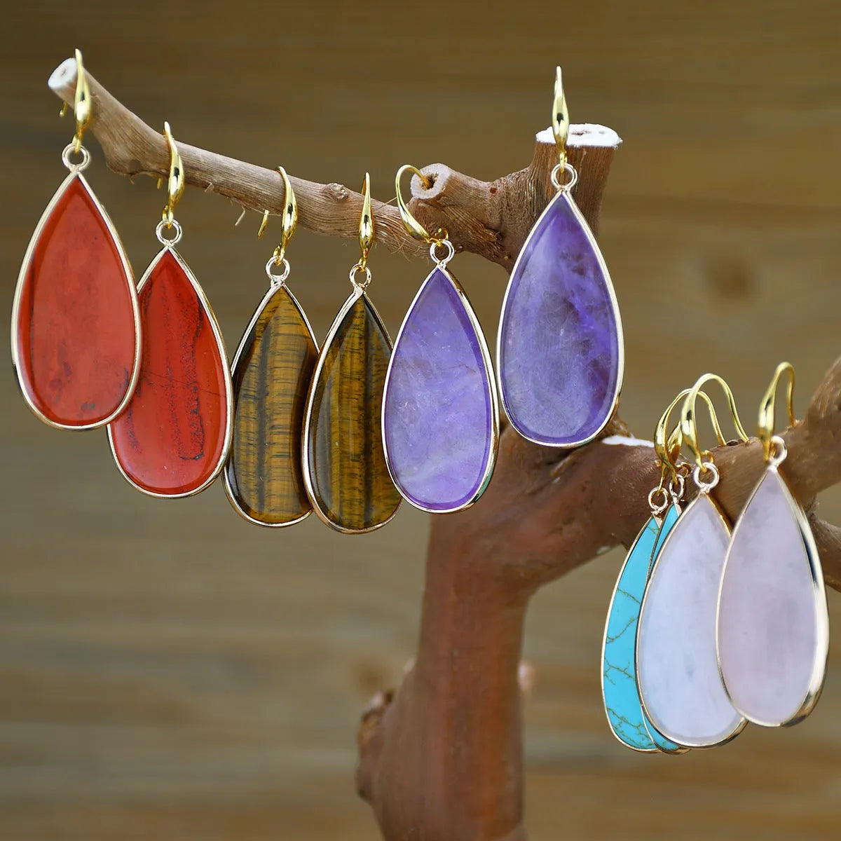 Vintage long water drop earrings in Tigereye stone, showing handmade retro design.