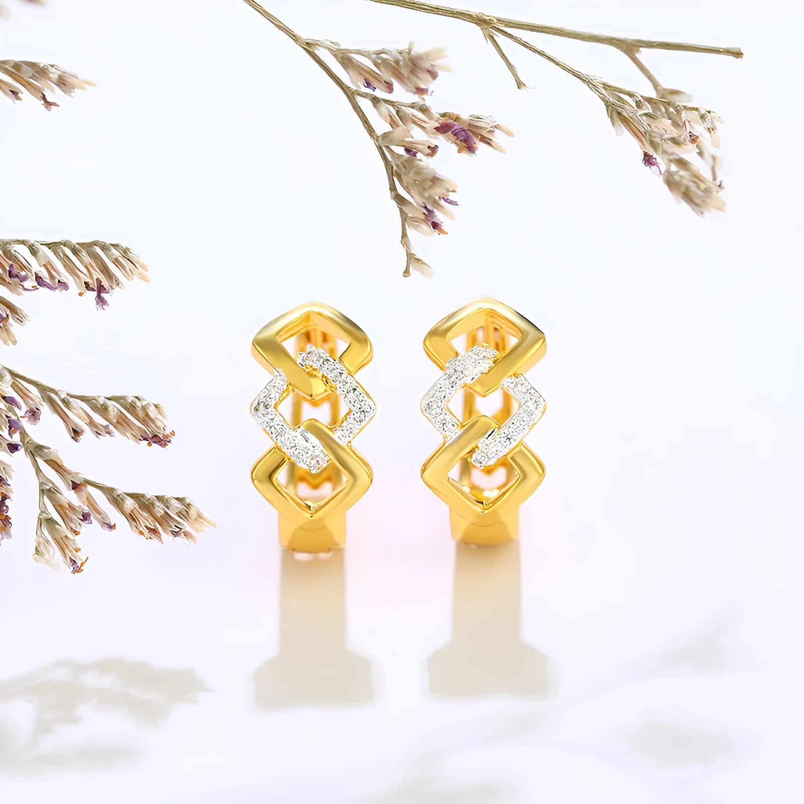 Gold geometric hollow-out alloy earrings with ear clip fastening and colour separation electroplating