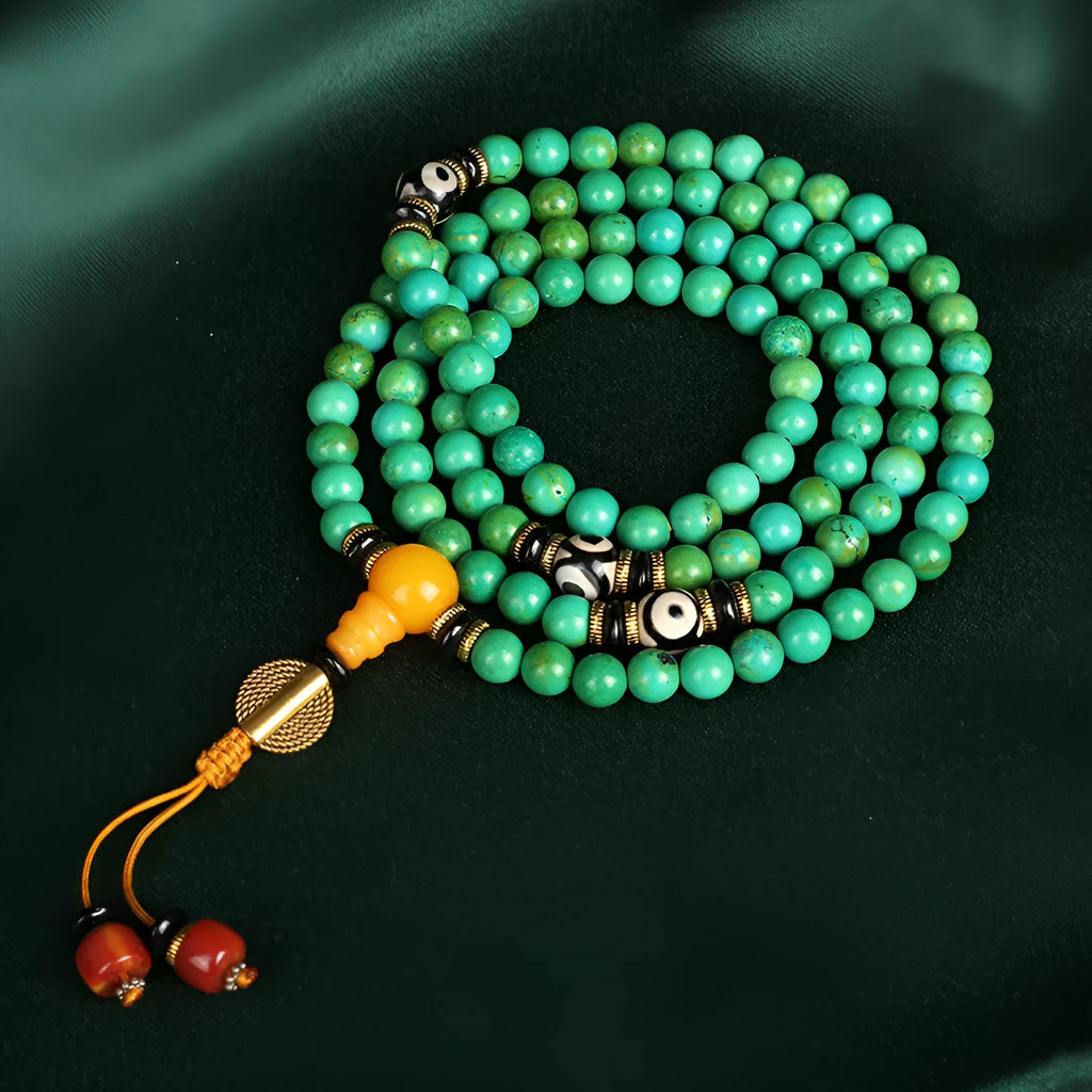 Natural turquoise bracelet with 108 round 8mm beads on wrist showing polished stone texture