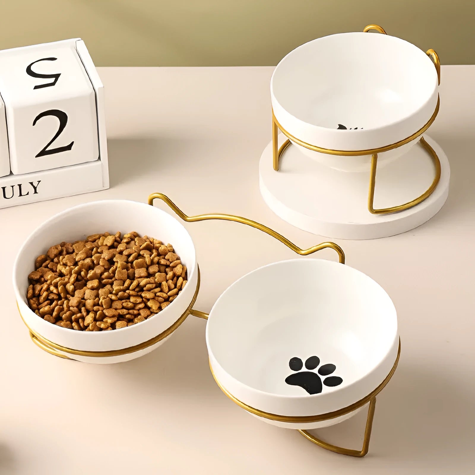 Ceramic pet bowl with iron frame featuring cat footprints pattern