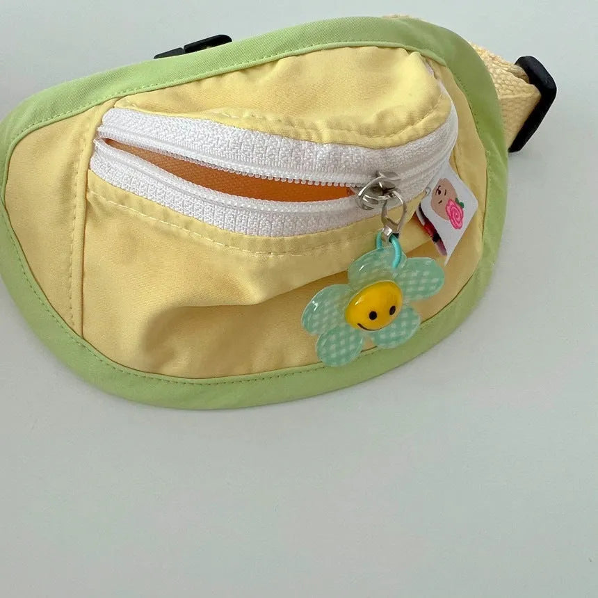 Powder blue, yellow, and green backpack-style messenger bag dog and cat carrier.