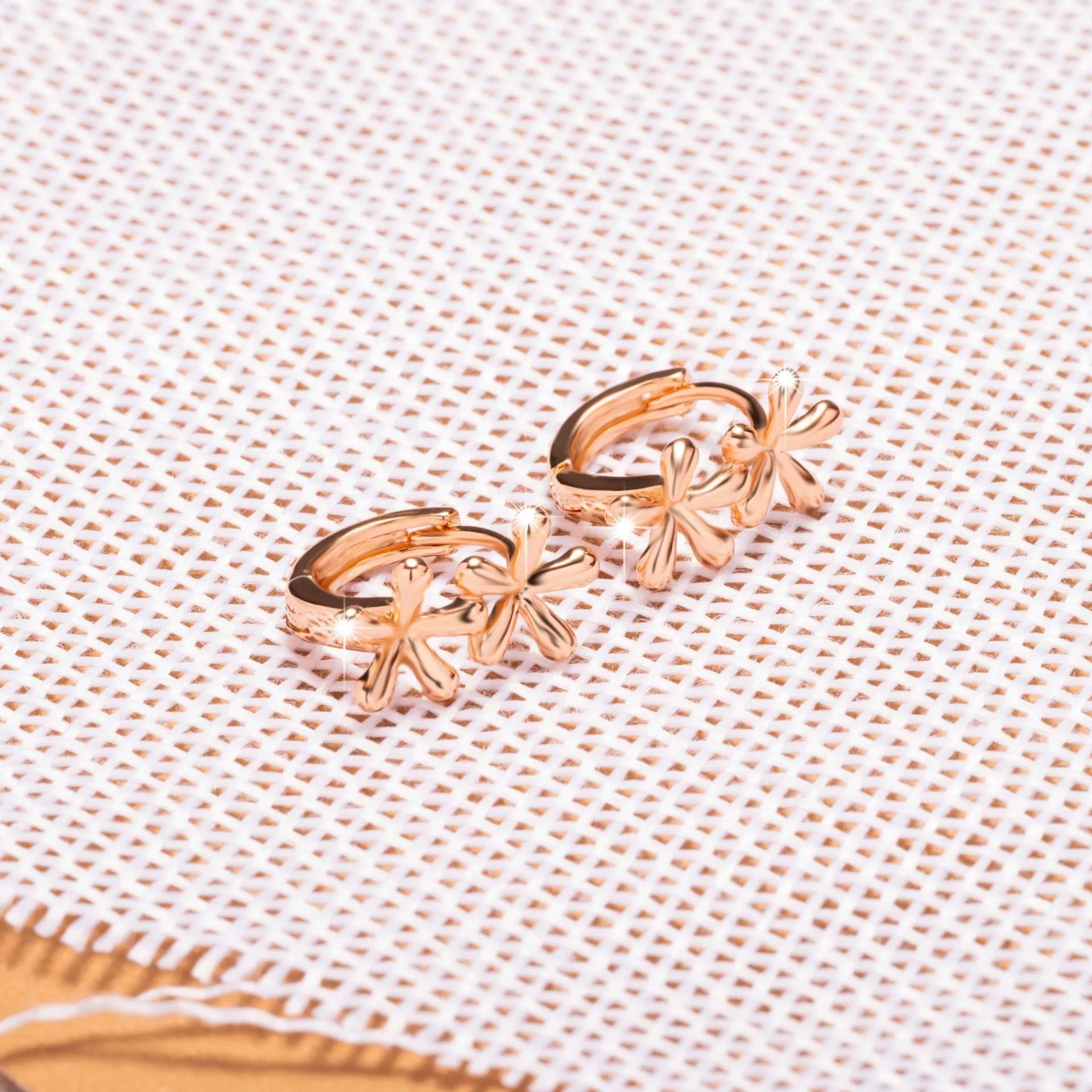 Rose gold waterdrop flower earrings with circular design and electroplated finish