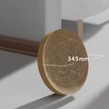 Large circular cardboard cat scratching board with integrated ball toys and replaceable core