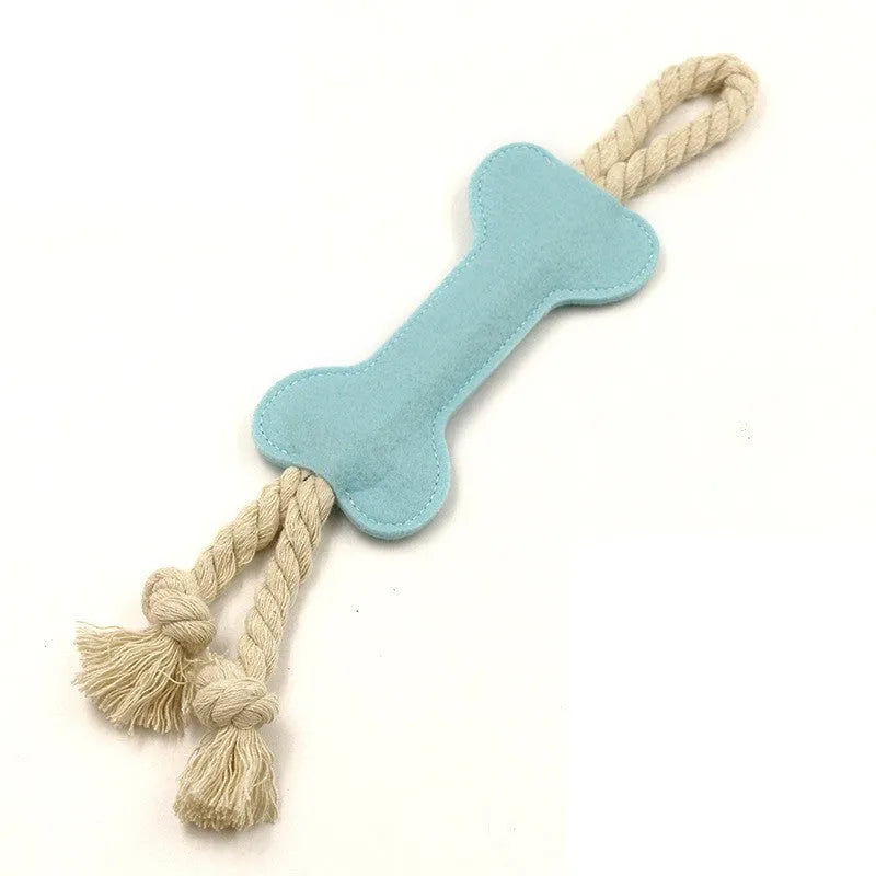 Bone-shaped felt dog chew toy with rope knot interior in blue, shown next to a tape measure indicating 16 cm length.